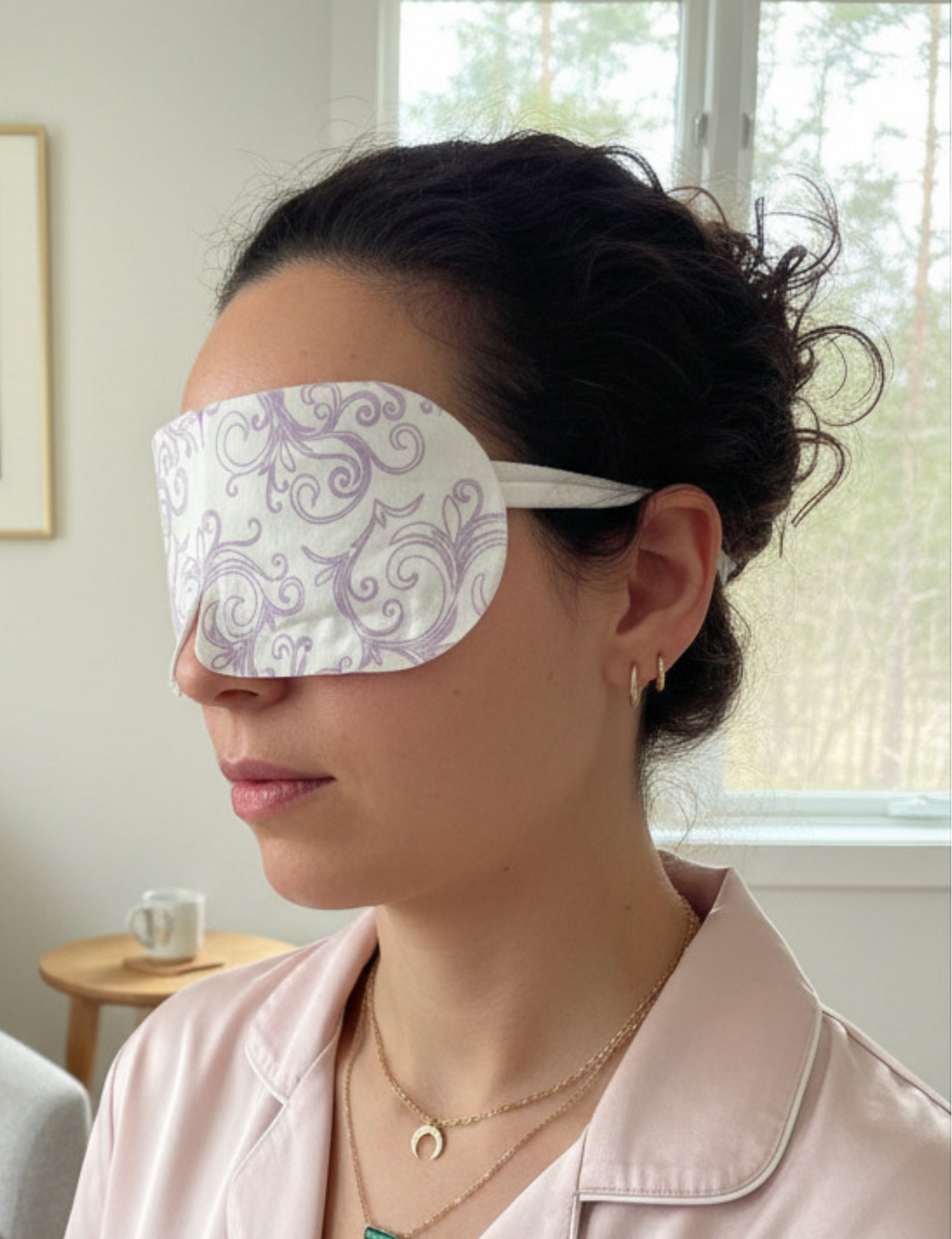 Woman wearing a decorative eye mask in a living room setting