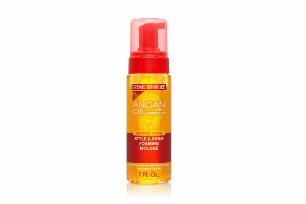 Creme of Nature Argan Oil foaming mousse bottle with red cap and orange label.