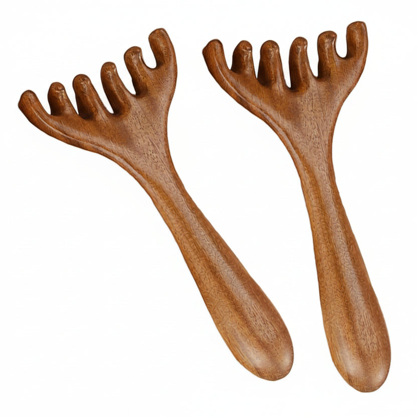 Two wooden massage tools with grooved handles on a white background