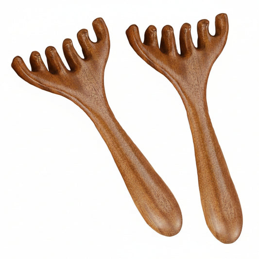 Two wooden massage tools with grooved handles on a white background