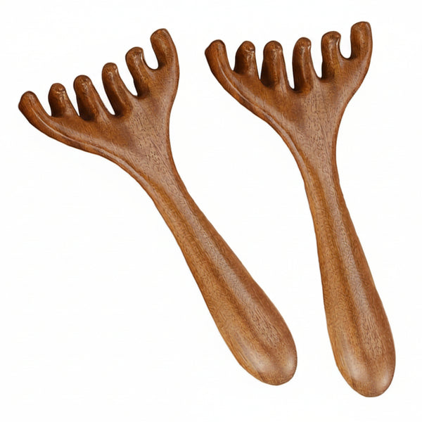 Two wooden massage tools with grooved handles on a white background