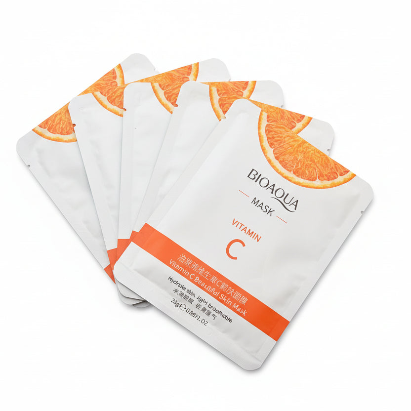 Bioaqua mask packaging with orange slices on a dark surface